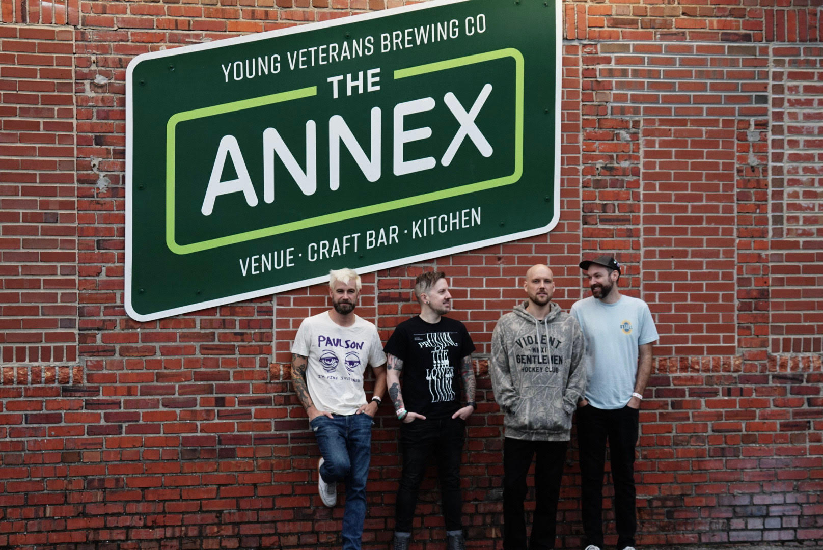 Red Weather band members on a couch